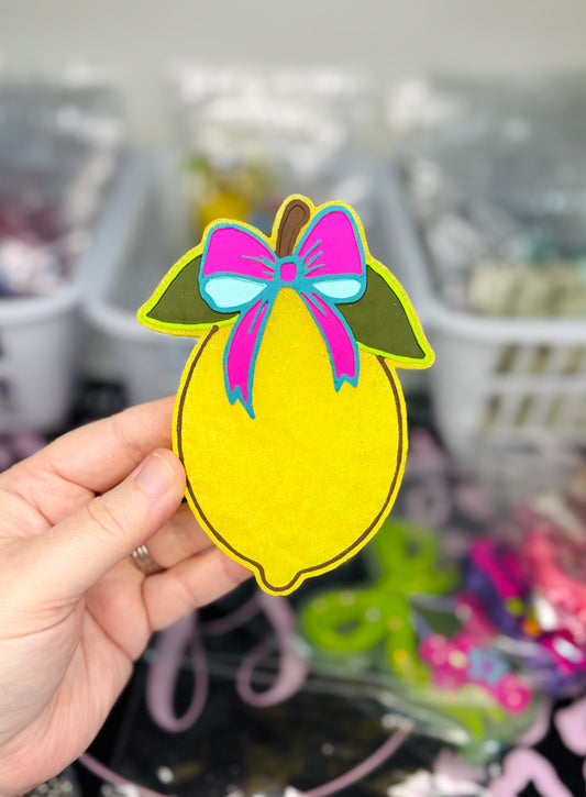 LEMON WITH A BOW IN UPPER CLASS AND TRAILER TRASH